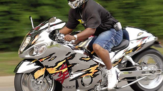 Drivers Use Cars To Protect Fallen Biker